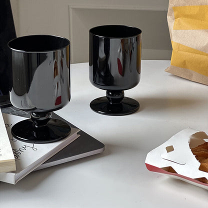 black stemmed glass
