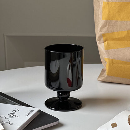 black stemmed glass